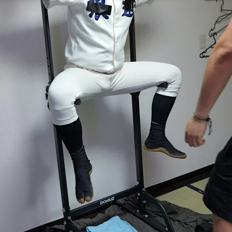 white baseball uniform with black jikatabi boots.